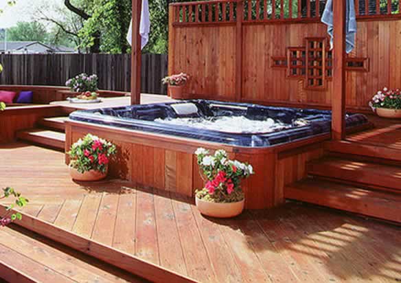 Redwood boards surround an inviting spa.