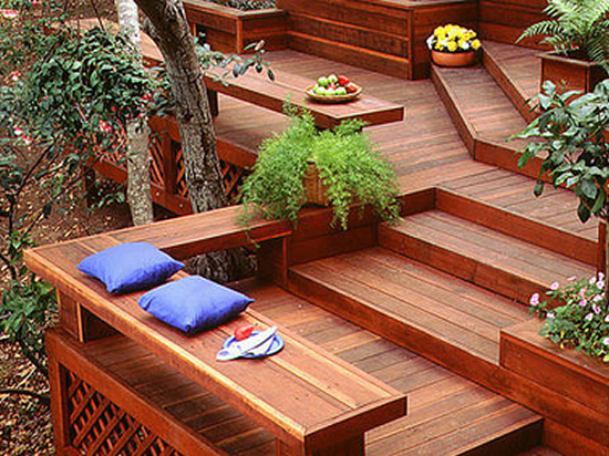 A beautiful redwood deck with built-in bench and retaining wall.