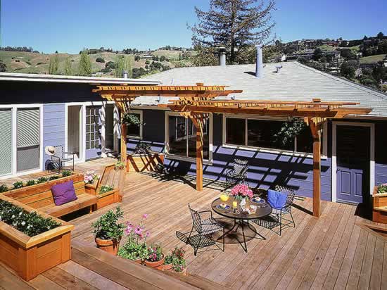 Redwood multi-level deck with built-in planters and bench.