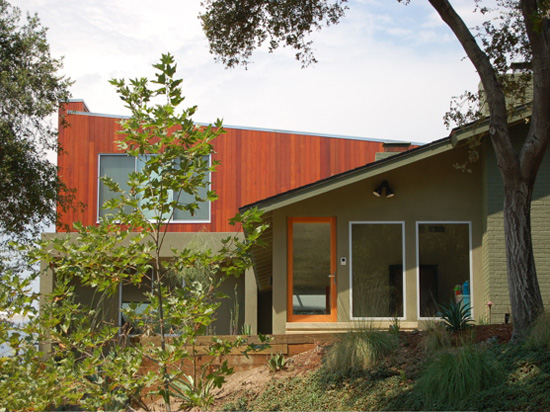 A beautiful redwood deck with built-in bench and retaining wall.