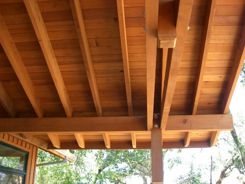 Redwood beams, boards and timbers form a beautiful interior ceiling on a custom home.