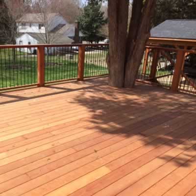 Redwood decking built around a large tree.